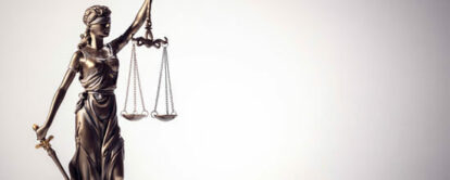 Legal law concept statue of Lady Justice with scales of justice background